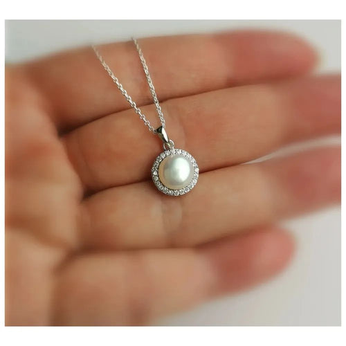White cultured pearl pendant necklace with cz halo